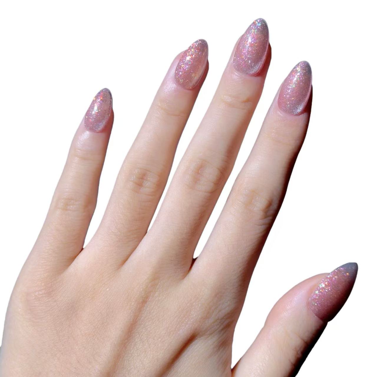 Hand with glittery pink nail polish on a white background